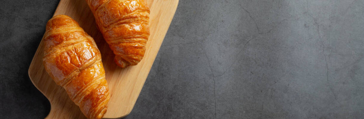 Croissants on black background.
